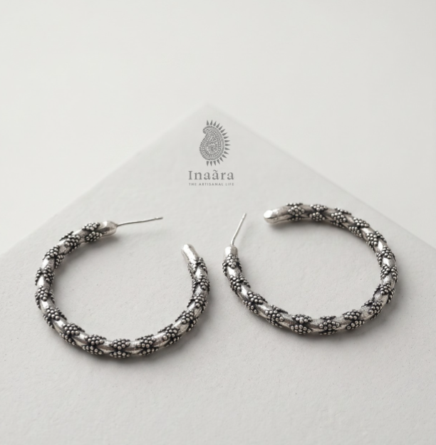 oxidized silver hoop earrings.